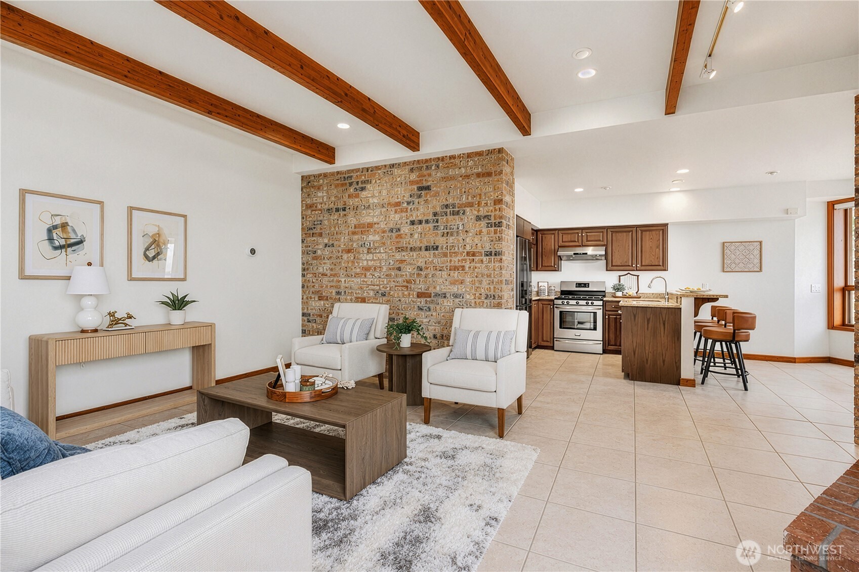 Spacious recreation room at lower level with fireplace and direct access to water and dock