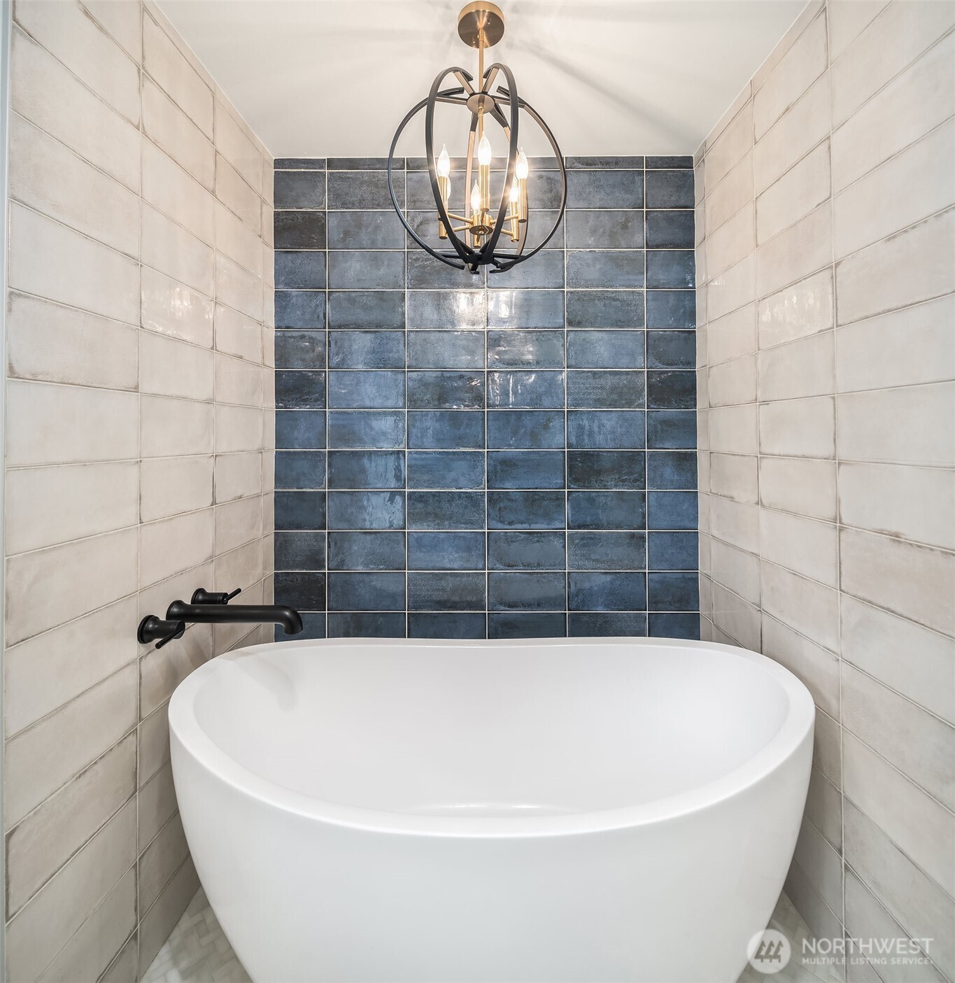 Elegant floating tub & well-appointed chandelier