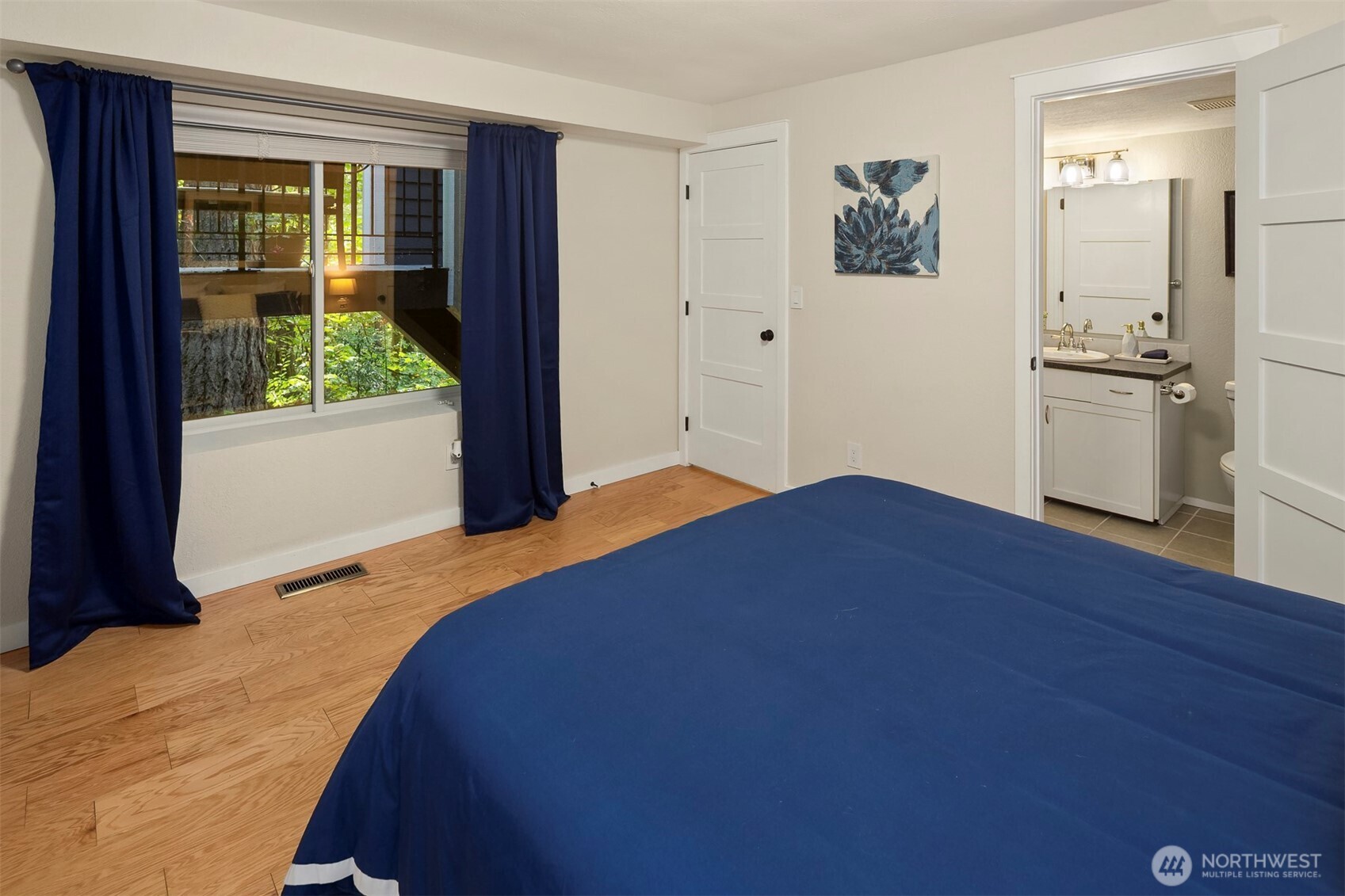 One of two bedrooms on the main level - that might be a second primary suite!
