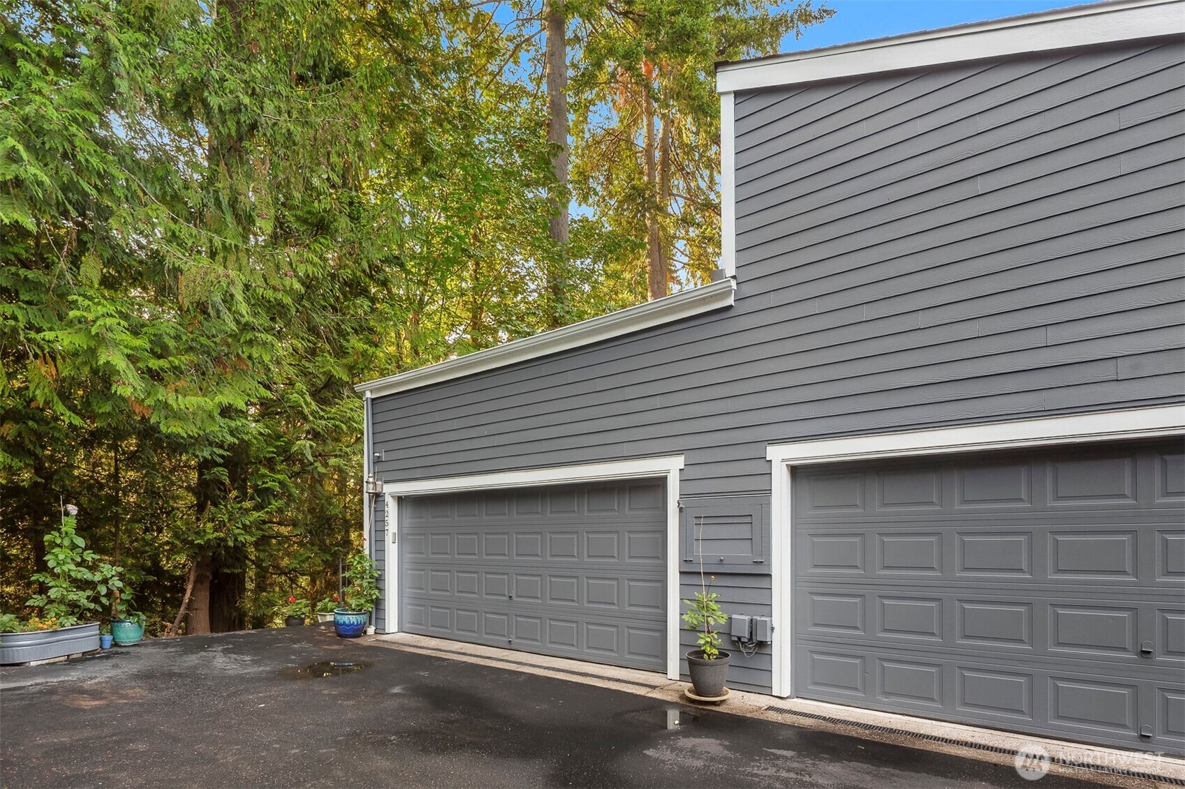 Two car garage with plenty of storage and work space