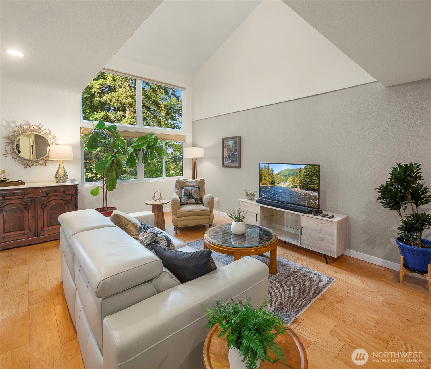 Spacious family room with a vaulted ceiling, stunning territorial views and plenty of natural light!