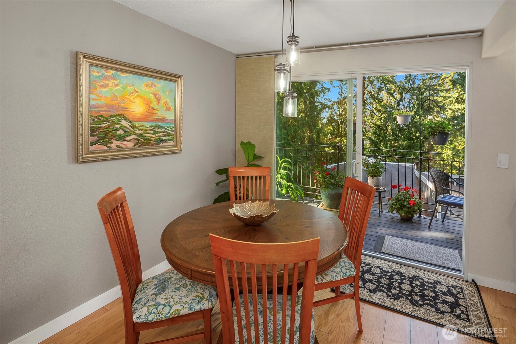 Dining room shown with sliders to the wrap-around deck.