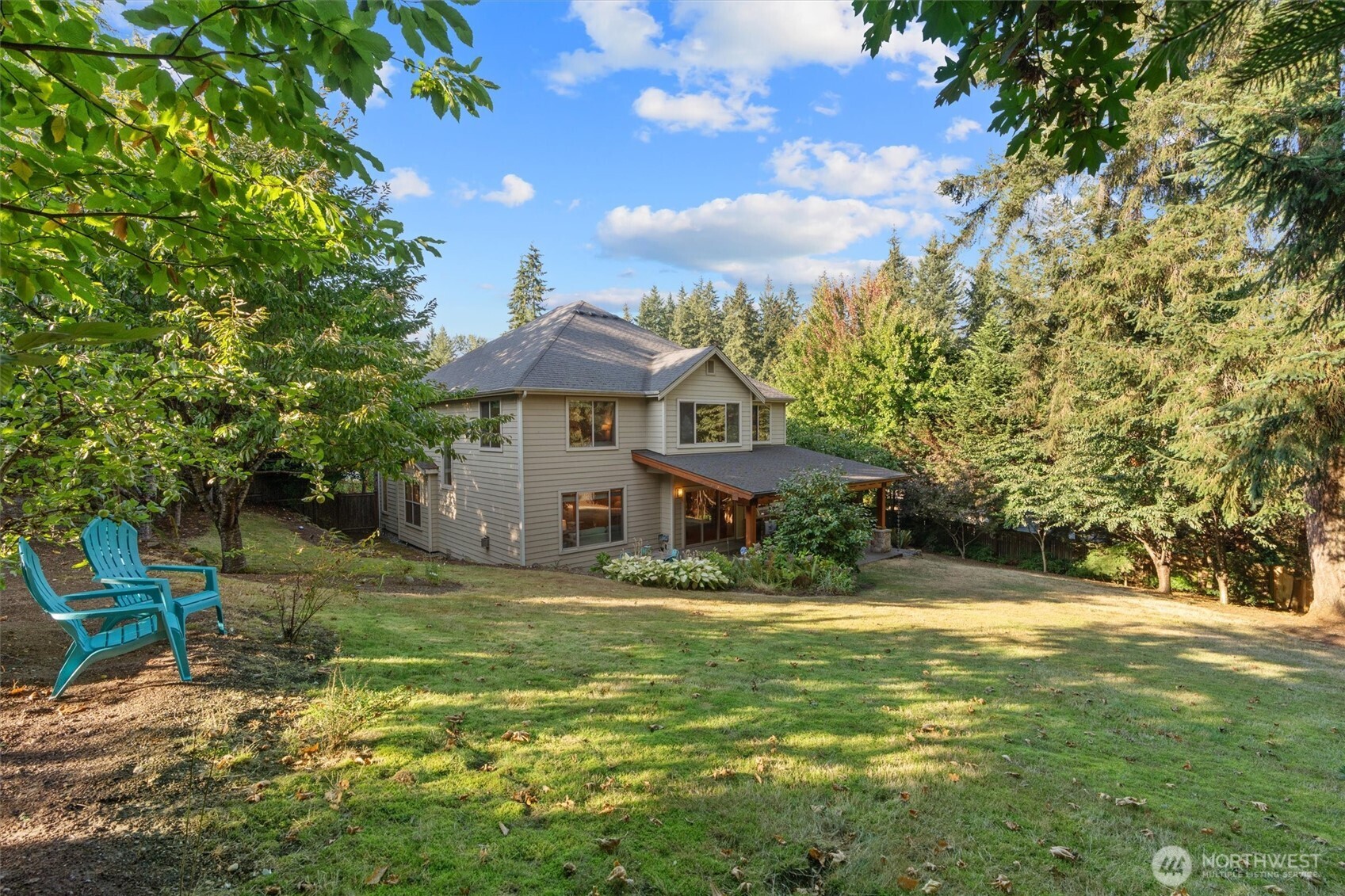 Sprawling lawns, fruit trees, and mature gardens.