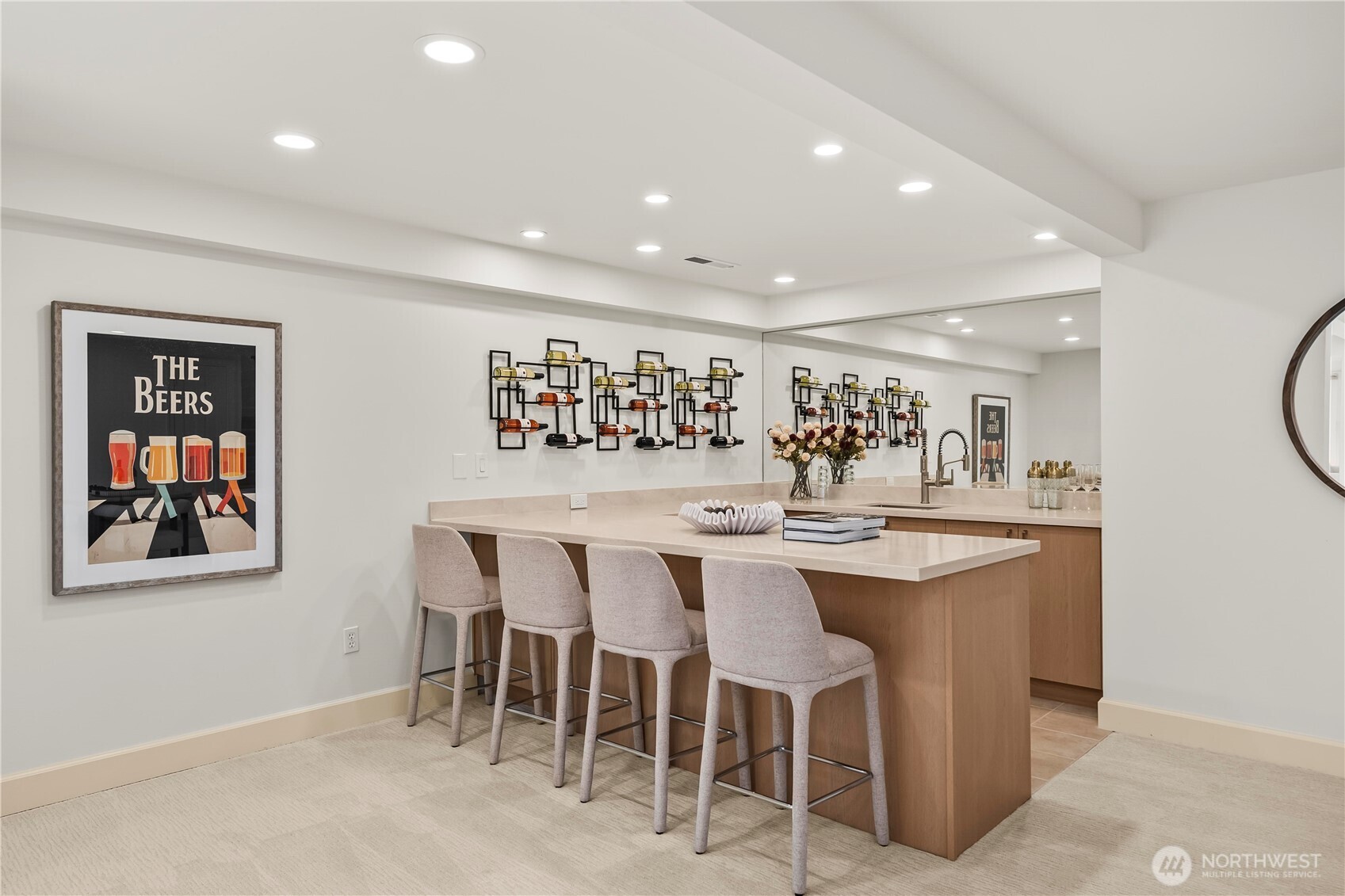 Stylish lower-level wet bar with generous seating—perfect for entertaining, game nights, and relaxed gatherings