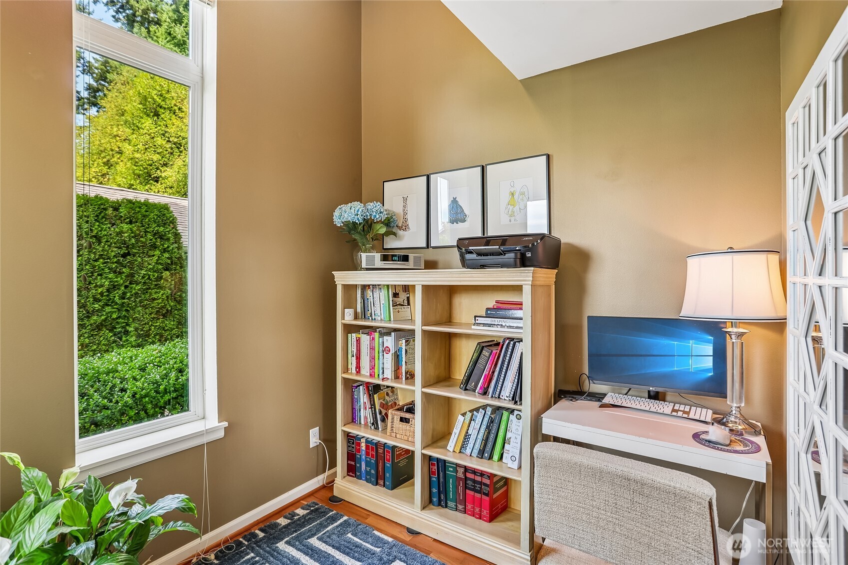 Bright dedicated home office in this Issaquah Highlands condo offers a comfortable and functional space for working from home, studying, or creative projects. Natural light and an efficient layout make this versatile office a valuable addition to the 1-bedroom floor plan, providing separation between work and living spaces.