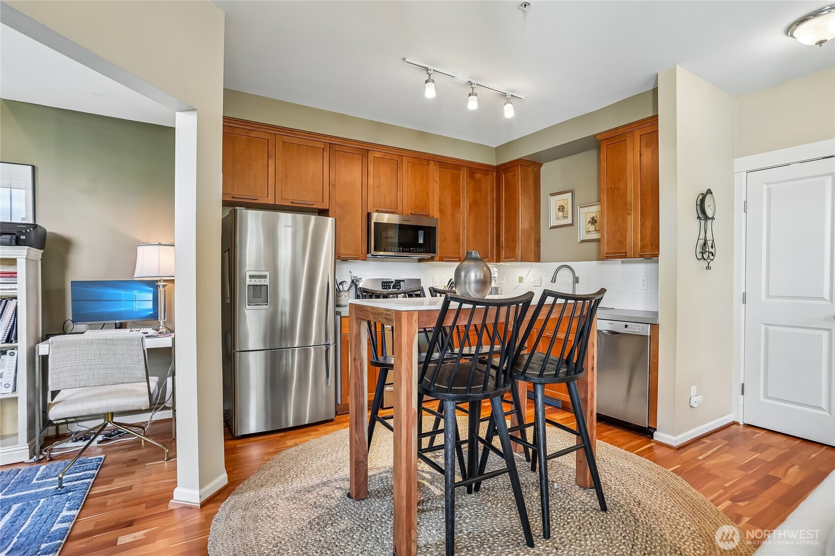 Bright, open-concept kitchen featuring stainless steel appliances and a functional layout that flows seamlessly into the living area. The open design creates an inviting space for everyday living and entertaining while making the most of the condo’s thoughtfully designed floor plan.