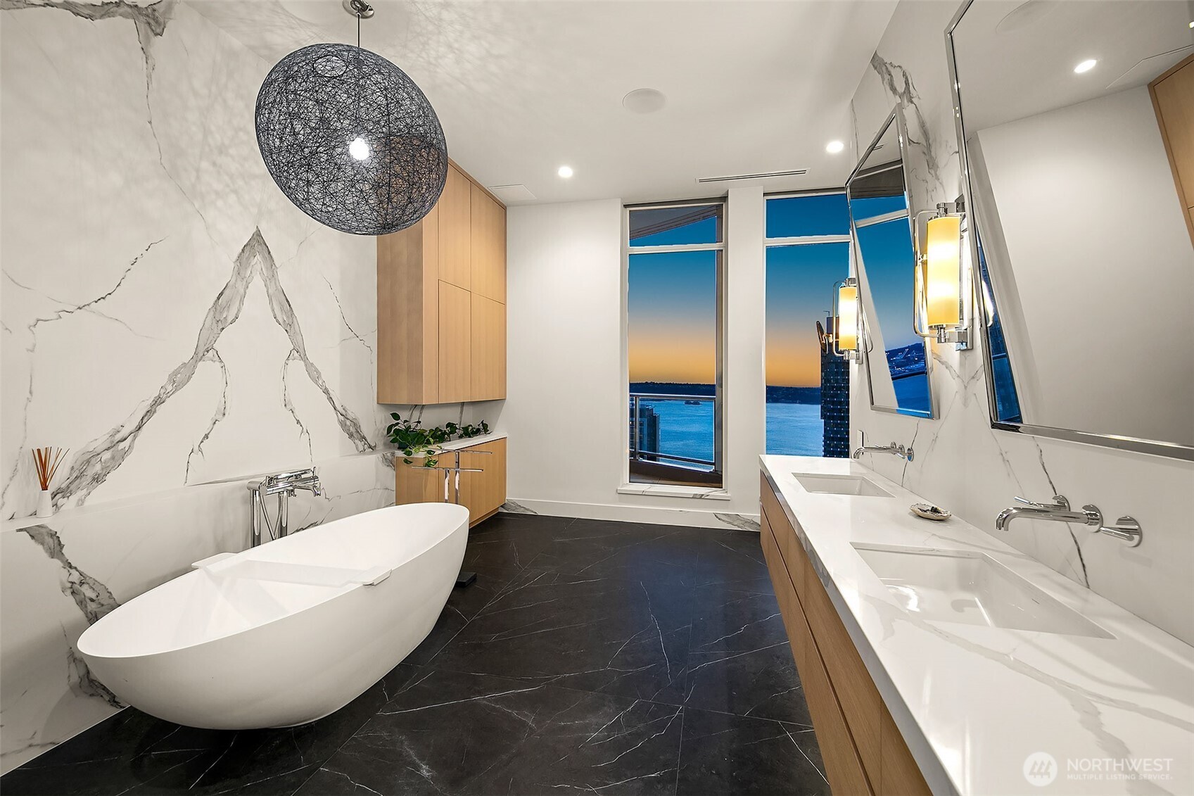 primary bath offers western water city and mountain views