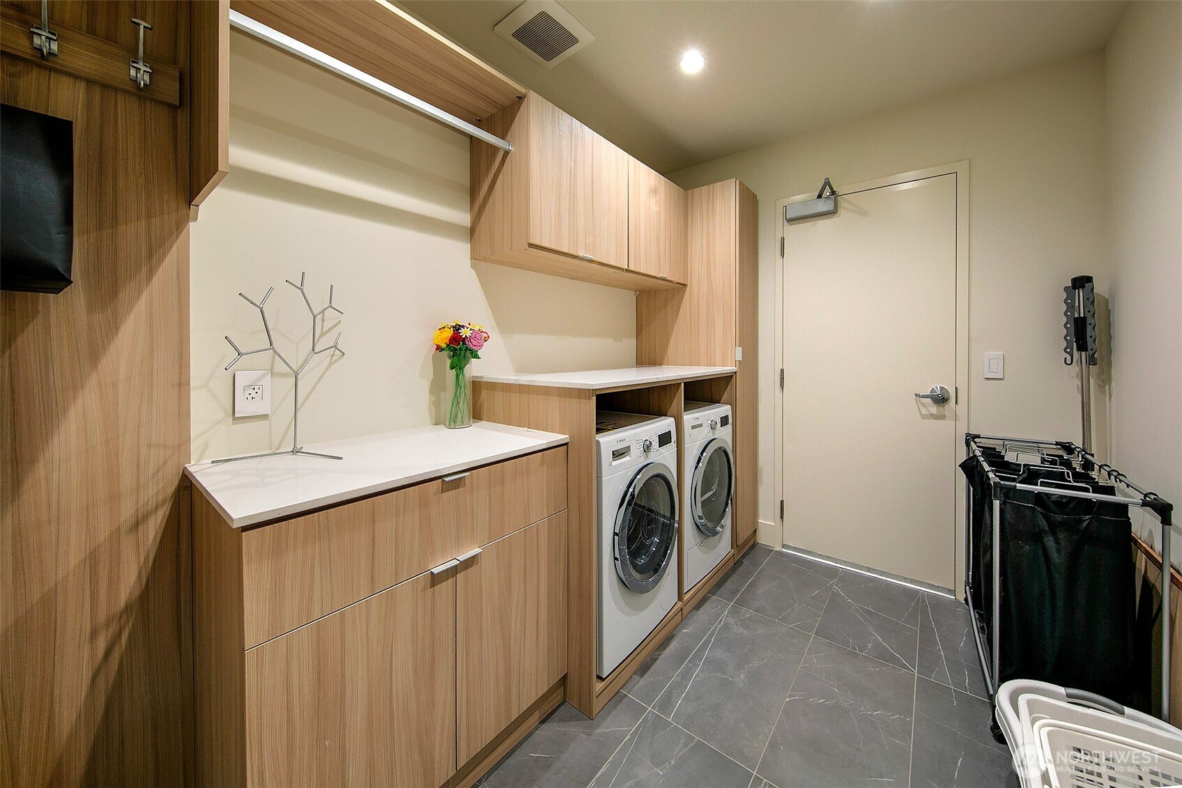 one of 2 laundry rooms this is off the primary closet with access to back utility corridor