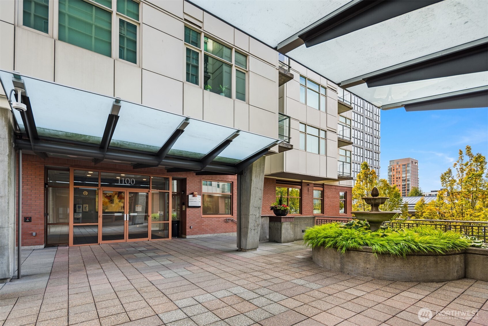 An elegant building entry and grounds await!