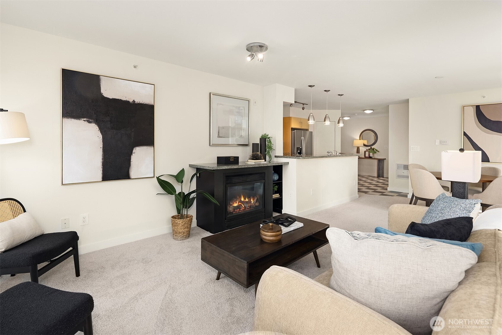 The cozy gas fireplace anchors the living room.