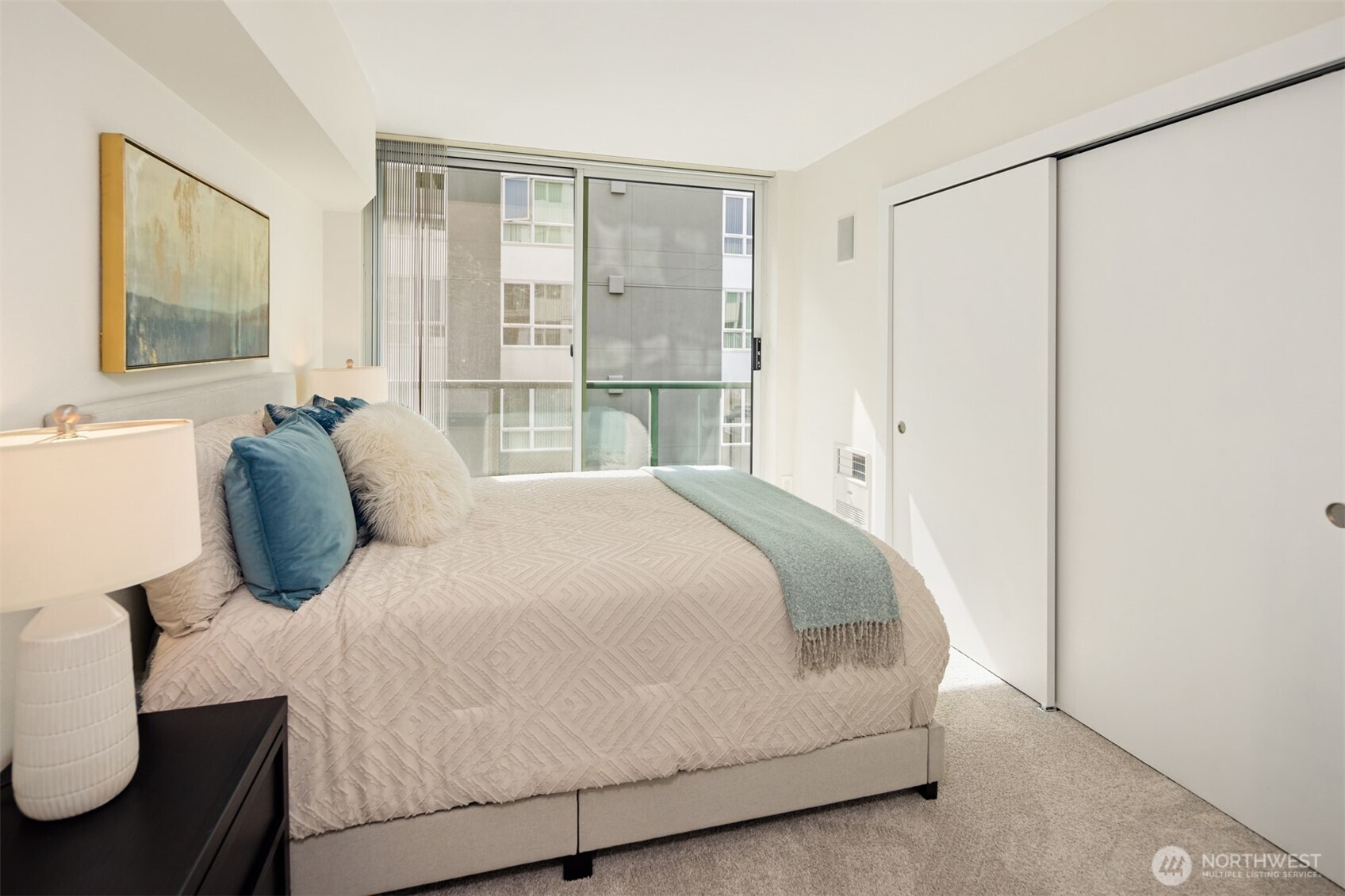 The second bedroom has a delightful Juliet balcony and a large closet.