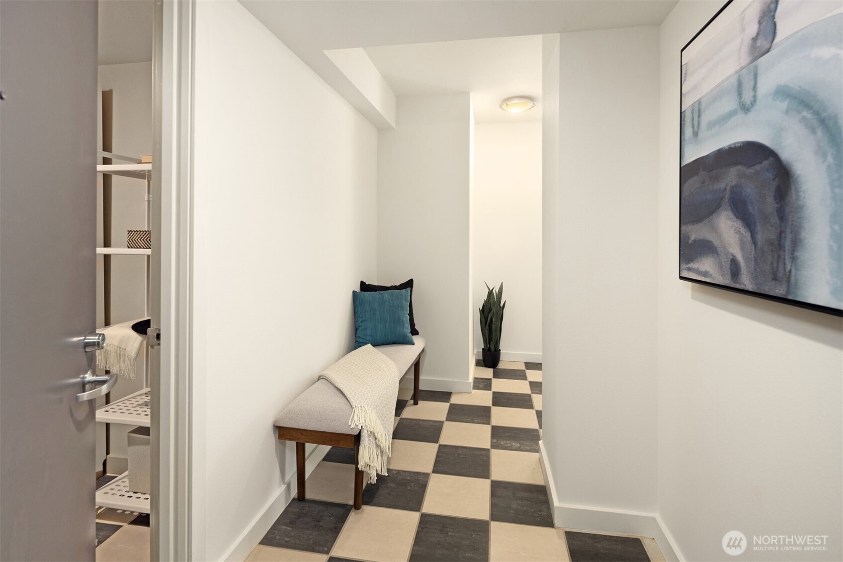 Step inside to a spacious hallway with beautiful decorative tile floors.