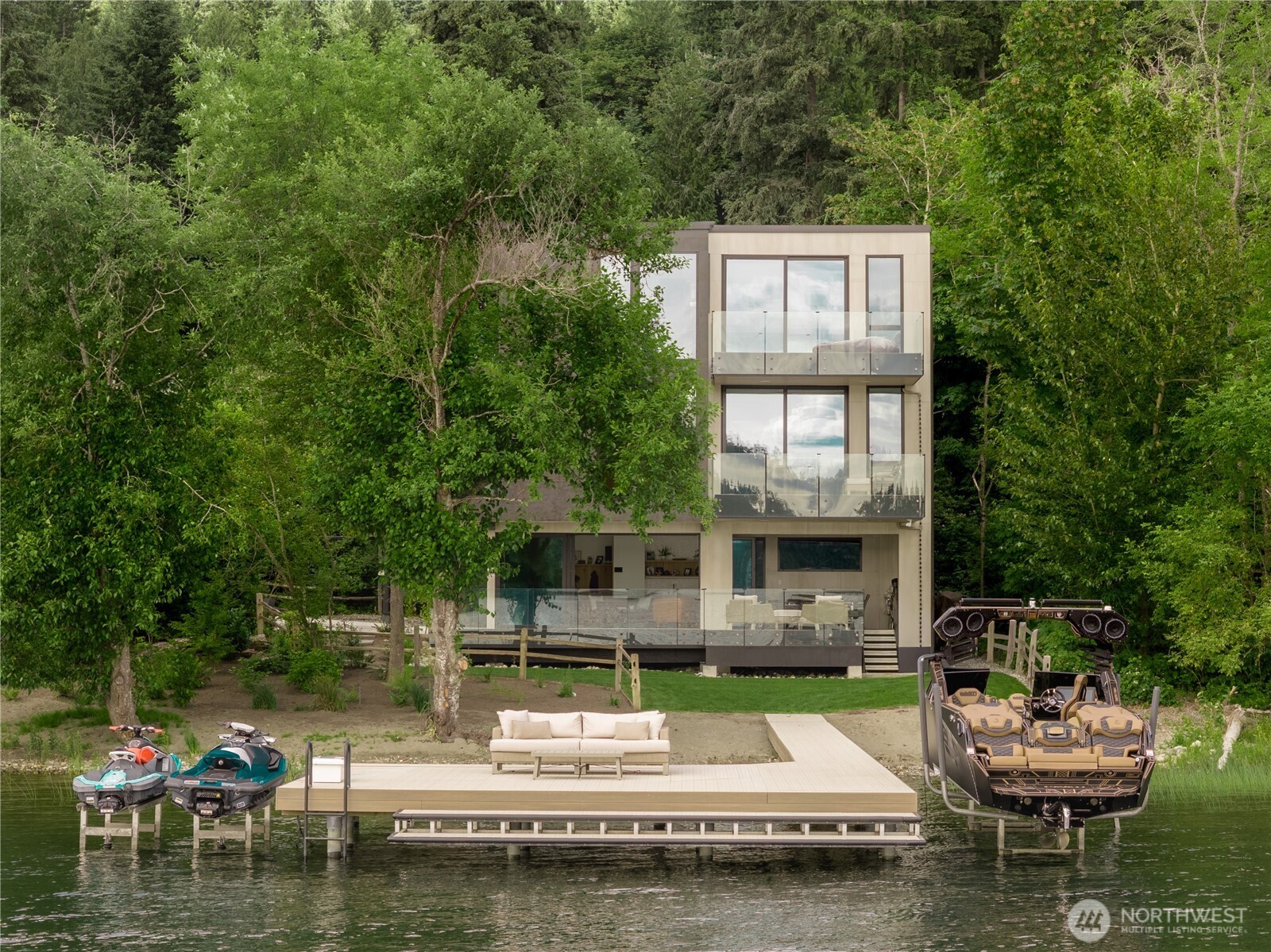 From the lake, the full composition comes  into view: 122' of shoreline, mature canopy,  and architecture set carefully within it.