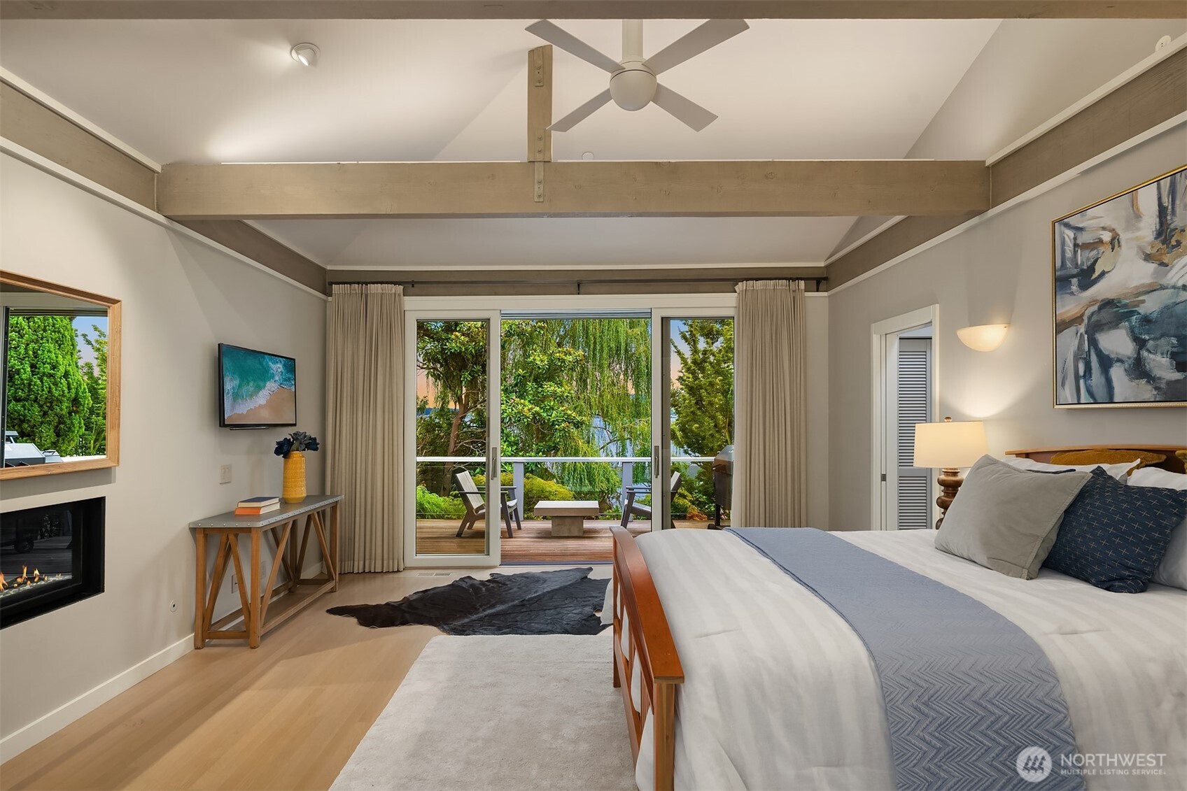 Media room or flexible as an additional bedroom on the main level with en suite three-quarter bathroom.