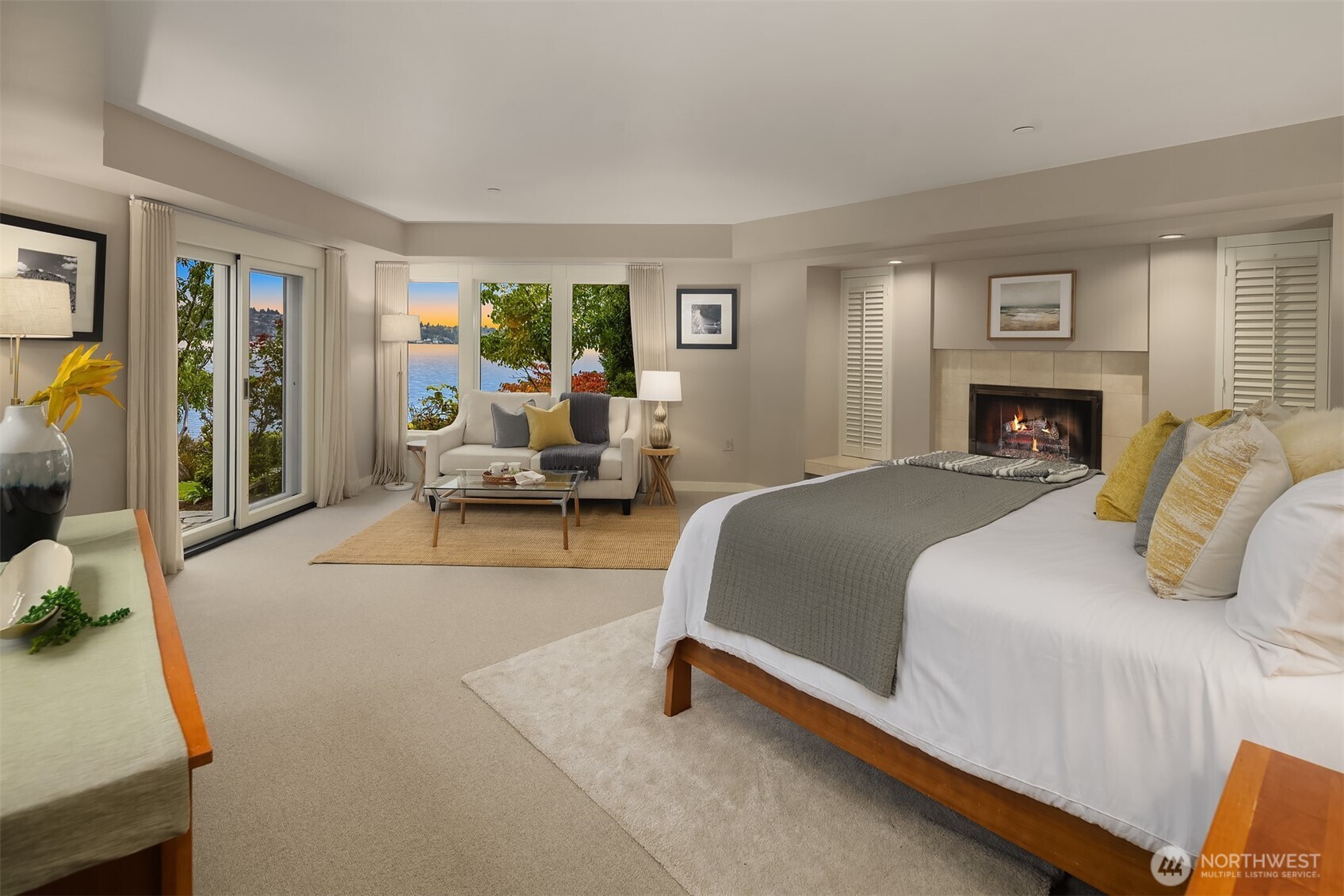 Lake view primary suite, 1 of 3 bedrooms downstairs with direct, walk-out access to the grounds.