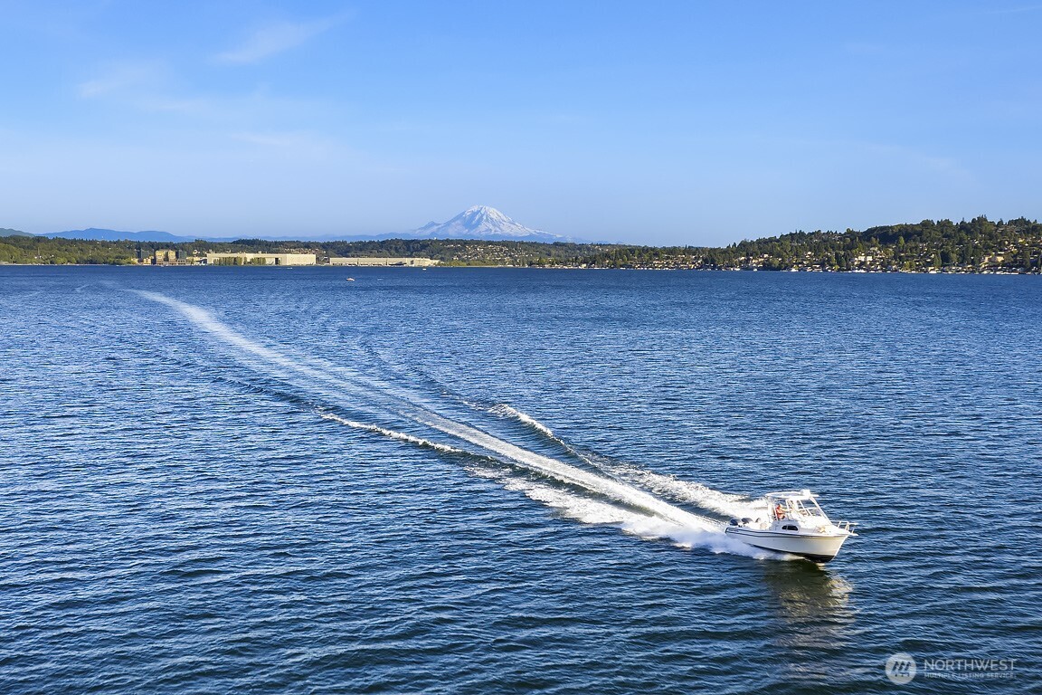 Private dock with covered boat lift and jet ski lifts.