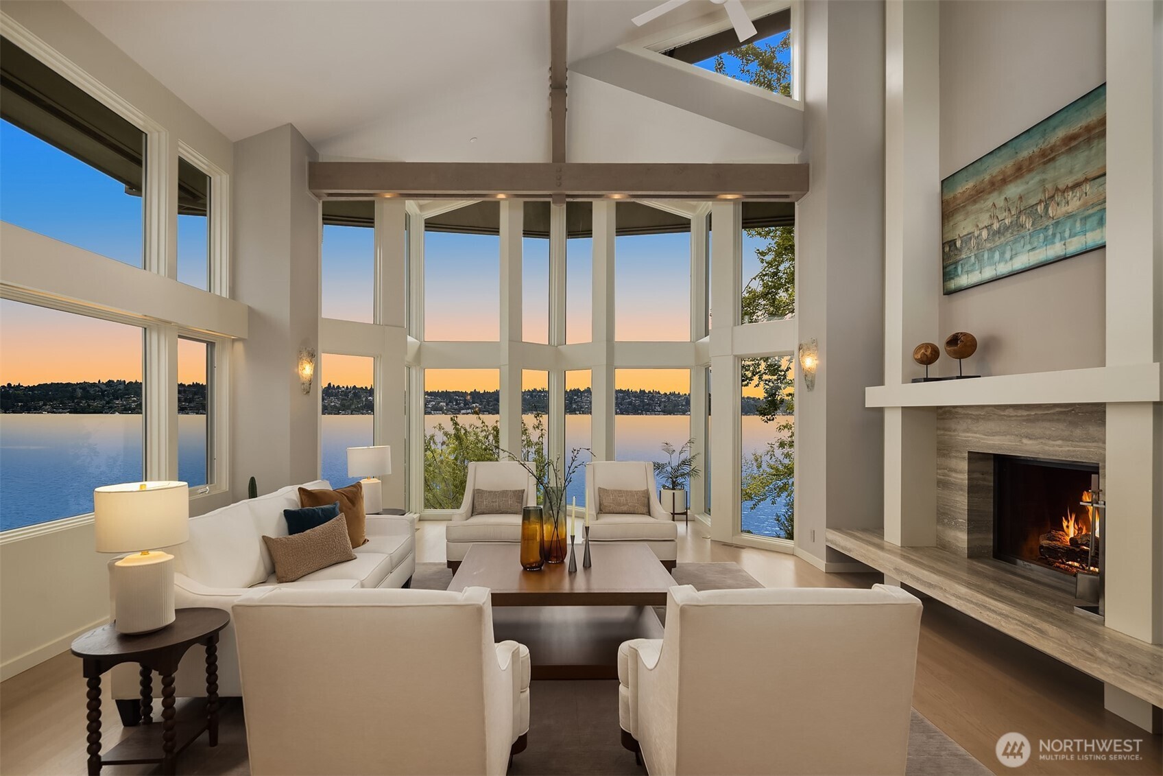 Light-filled, 2-story glass living room with soaring ceilings.