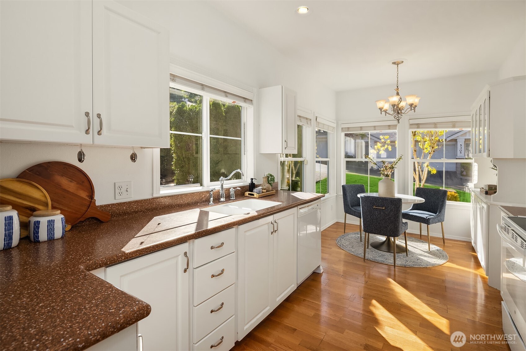 Bright, cheerful kitchen with lofty ceilings & its own breakfast nook.