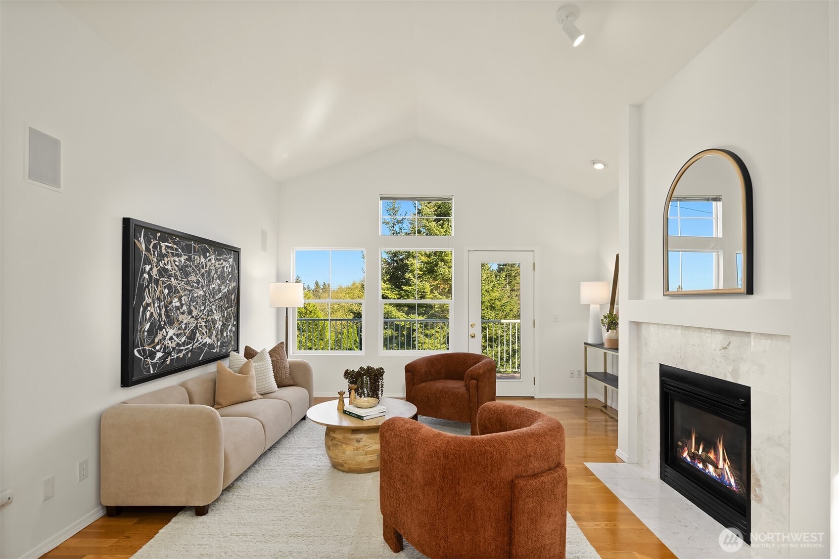Gather or relax alongside scenic windows & a warm, elegant fireplace.