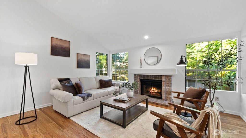Rich hardwood floors and abundance of windows in the living room.