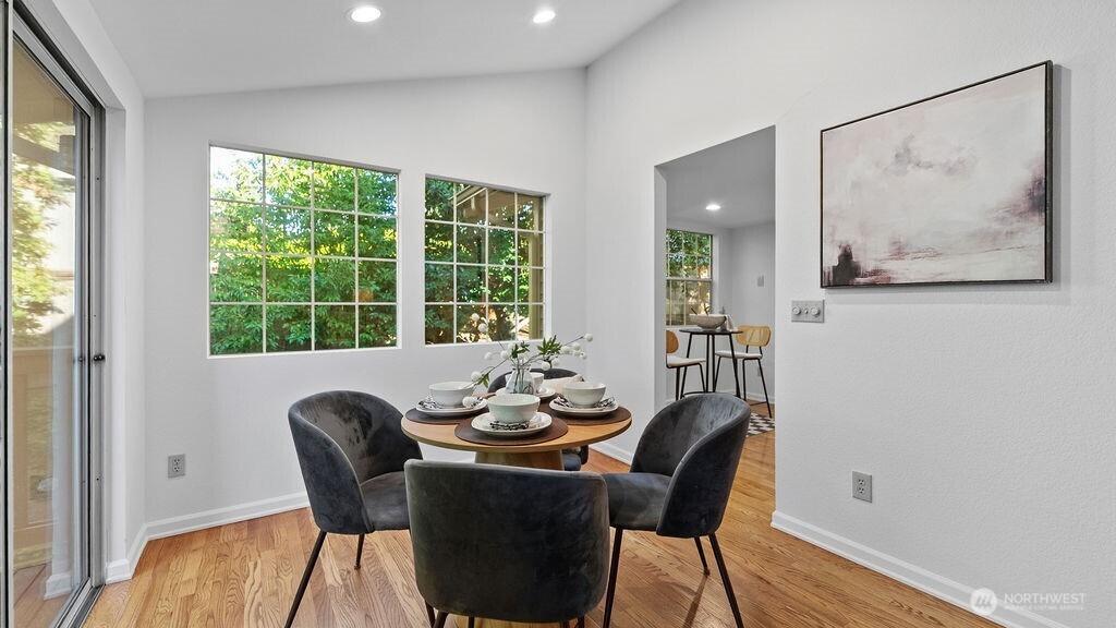 Peachful and light filled dining room with vaulted.