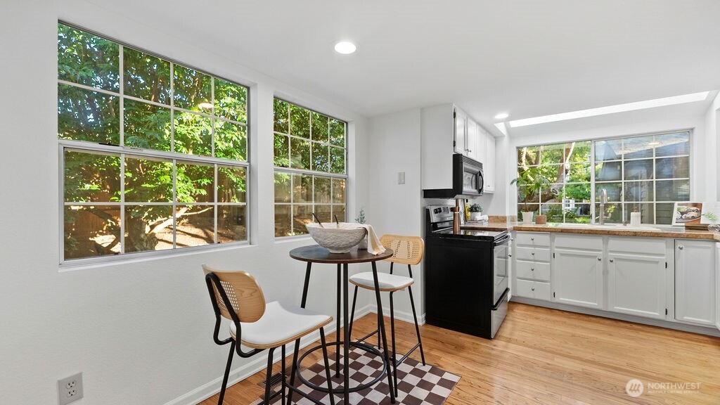 Sunny kitchen with eating space.